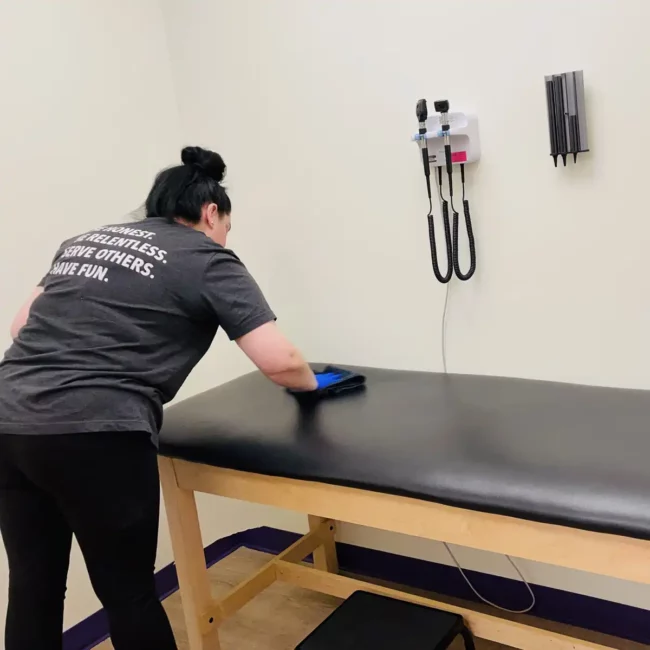 Premier Cleaning, LLC Medical Facility Cleaning Services - disinfecting medical exam room bed